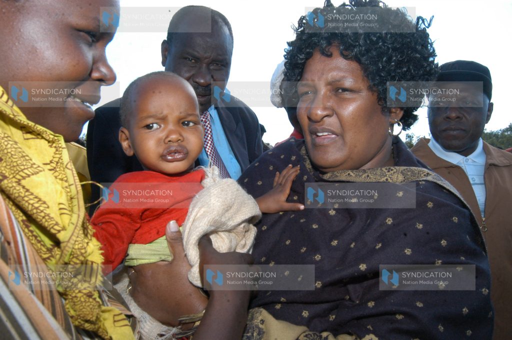 Special Programmes Minister Naomi Shaban holds child Enock Kepkemoi