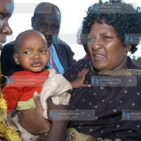 Special Programmes Minister Naomi Shaban holds child Enock Kepkemoi