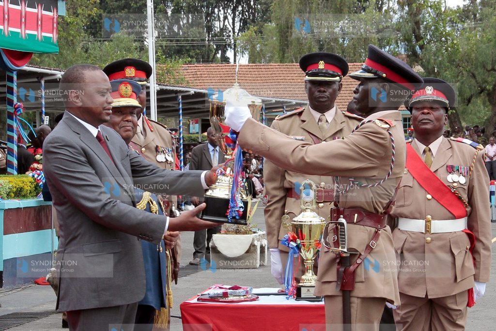 President Uhuru Kenyatta presents the Best Officer Cadet in Professional Studies Award