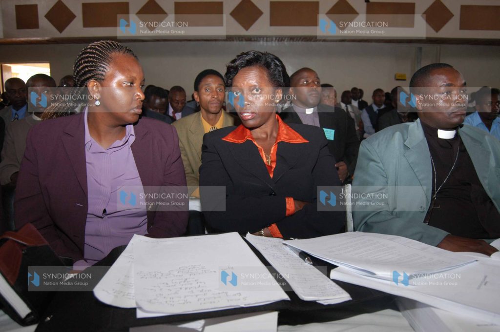 Gichugu MP Martha Karua, center, chats with Ms. Muthoni Kihara