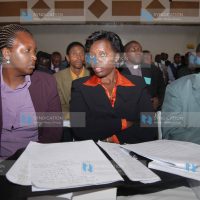 Gichugu MP Martha Karua, center, chats with Ms. Muthoni Kihara