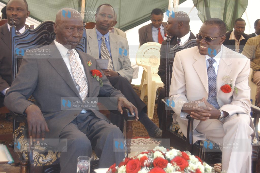Energy minister Kiraitu Murungi, right, chats with former President Daniel Moi