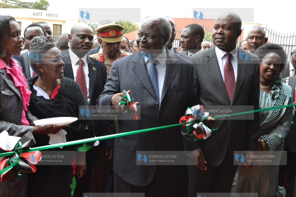 President Mwai Kibaki cuts the tape as he officially open Kamukunji Hawkers market