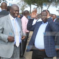 Mathira MP Peter Weru, right, chats with his political rival Rigathi Gachagua
