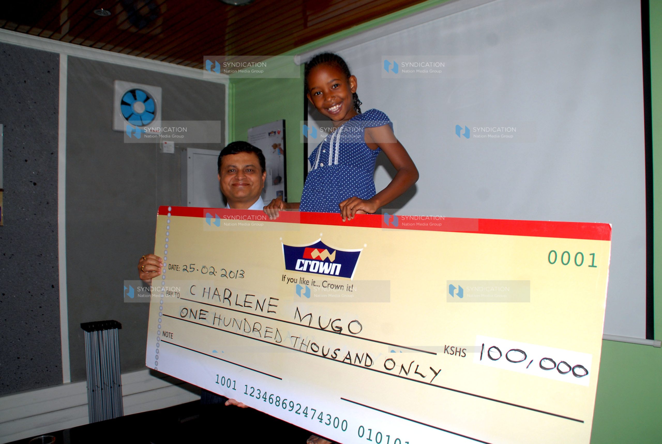 Dummy check of Ksh. 100,000 to nine year-old Charlene Mugo