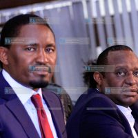 Devolution CS Mwangi Kiunjuri (left)