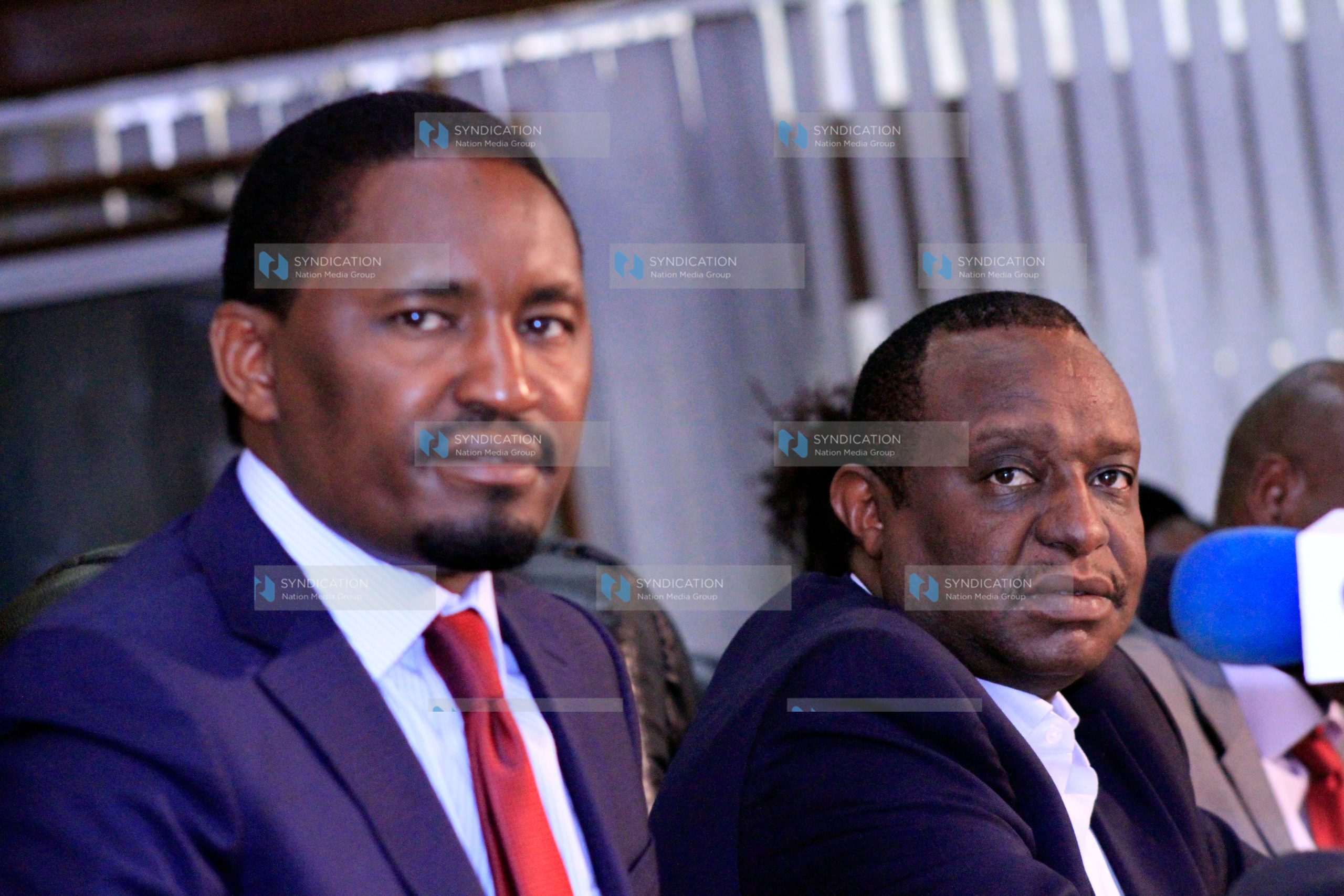 Devolution CS Mwangi Kiunjuri (left)