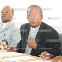 John Cardinal Njue (centre) addresses the press