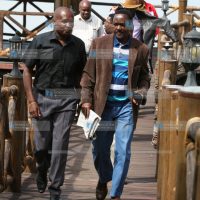 Kalonzo Musyoka (right) talks with Impala Ecolodge Group Operations Manager Martin Khaemba (left)