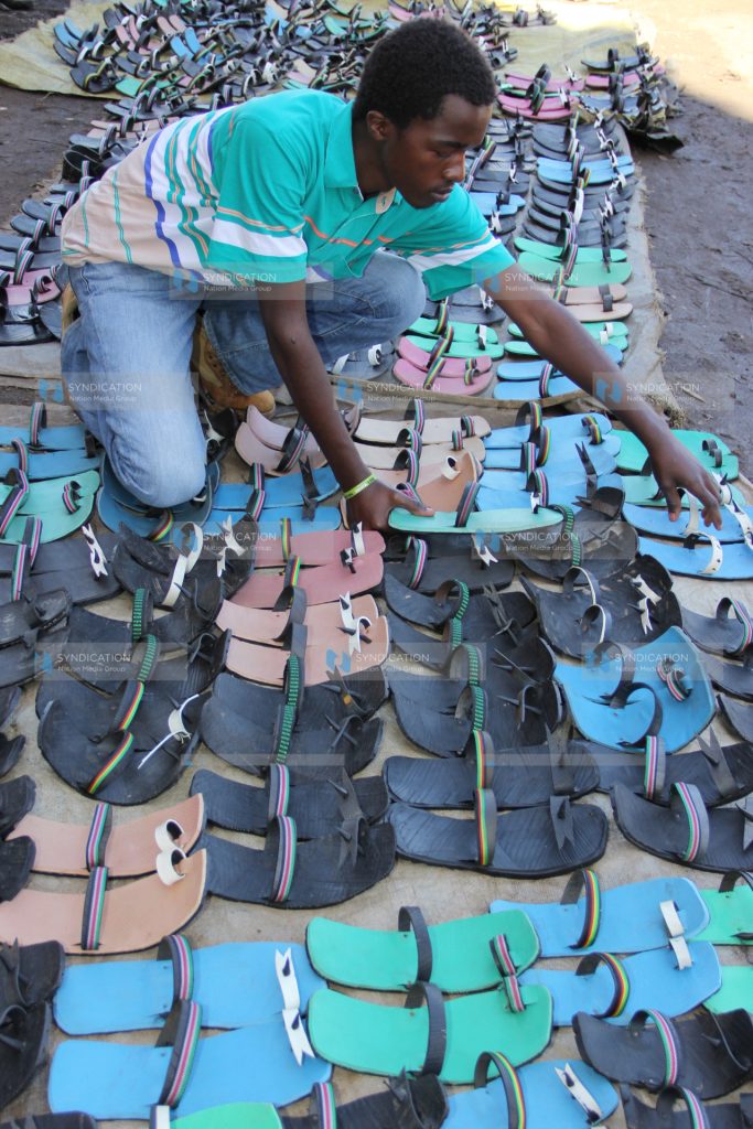Stephen Mwangi displays his wares, commonly known as Akala shoes