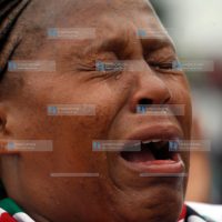 A Woman prays at Uhuru Park Grounds