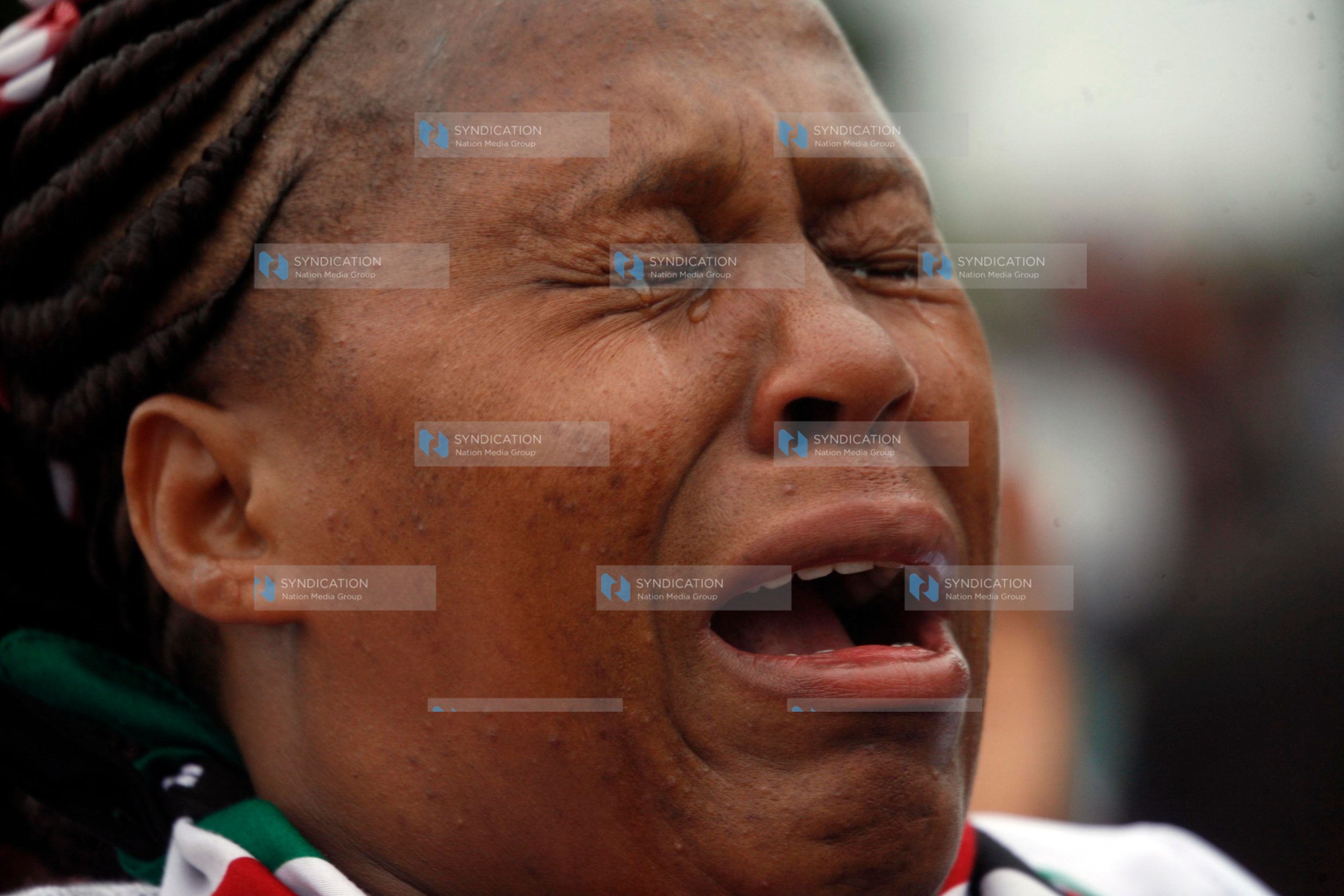 A Woman prays at Uhuru Park Grounds