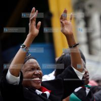A woman prays at Uhuru Park Grounds in Nairobi