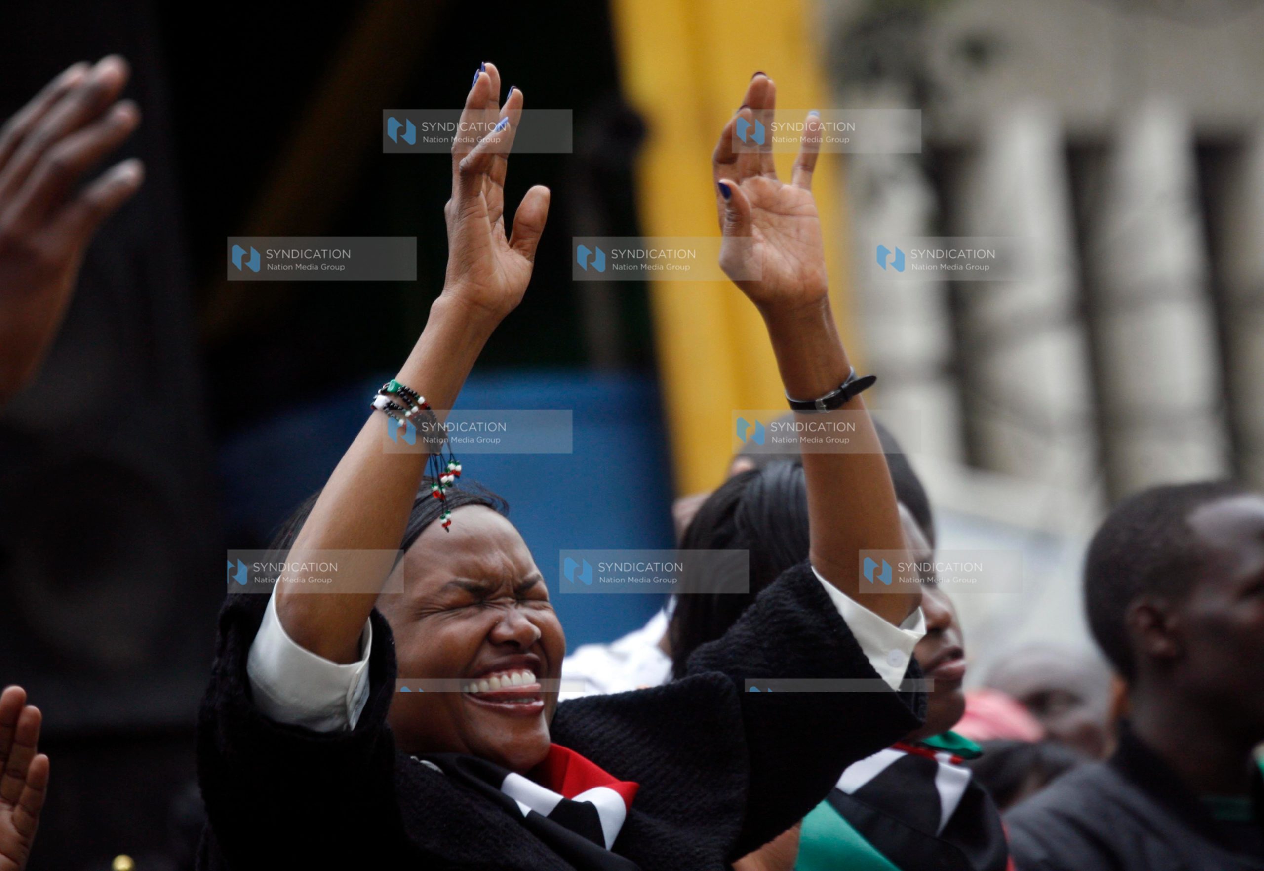 A woman prays at Uhuru Park Grounds in Nairobi