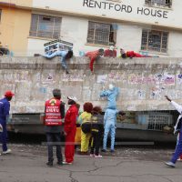 Sonko Rescue Team clean up posters left from the campaign season