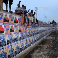 Campaign posters fill a wall at Caltex Grounds in Likoni, Mombasa County