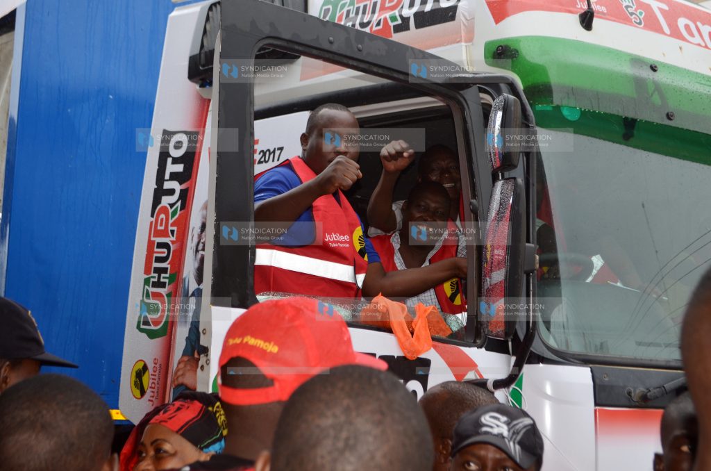 Jubilee Party supporters on a branded caravan
