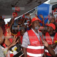 Jubilee Party supporters on a branded caravan