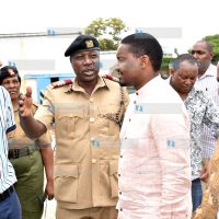 Agriculture Cabinet Secretary Mwangi Kiunjuri (right)