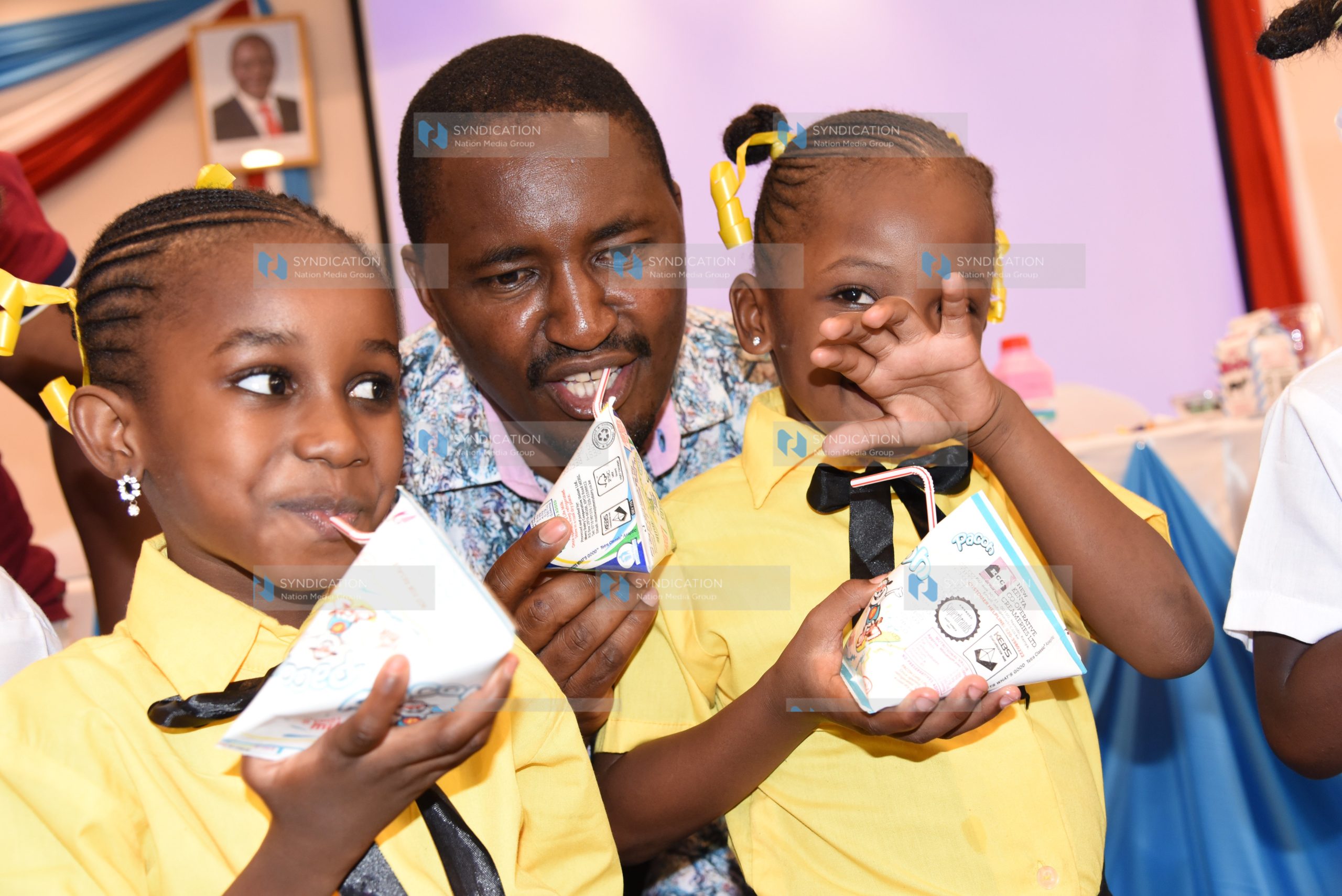 Agriculture Cabinet Secretary Mwangi Kiunjuri (centre)