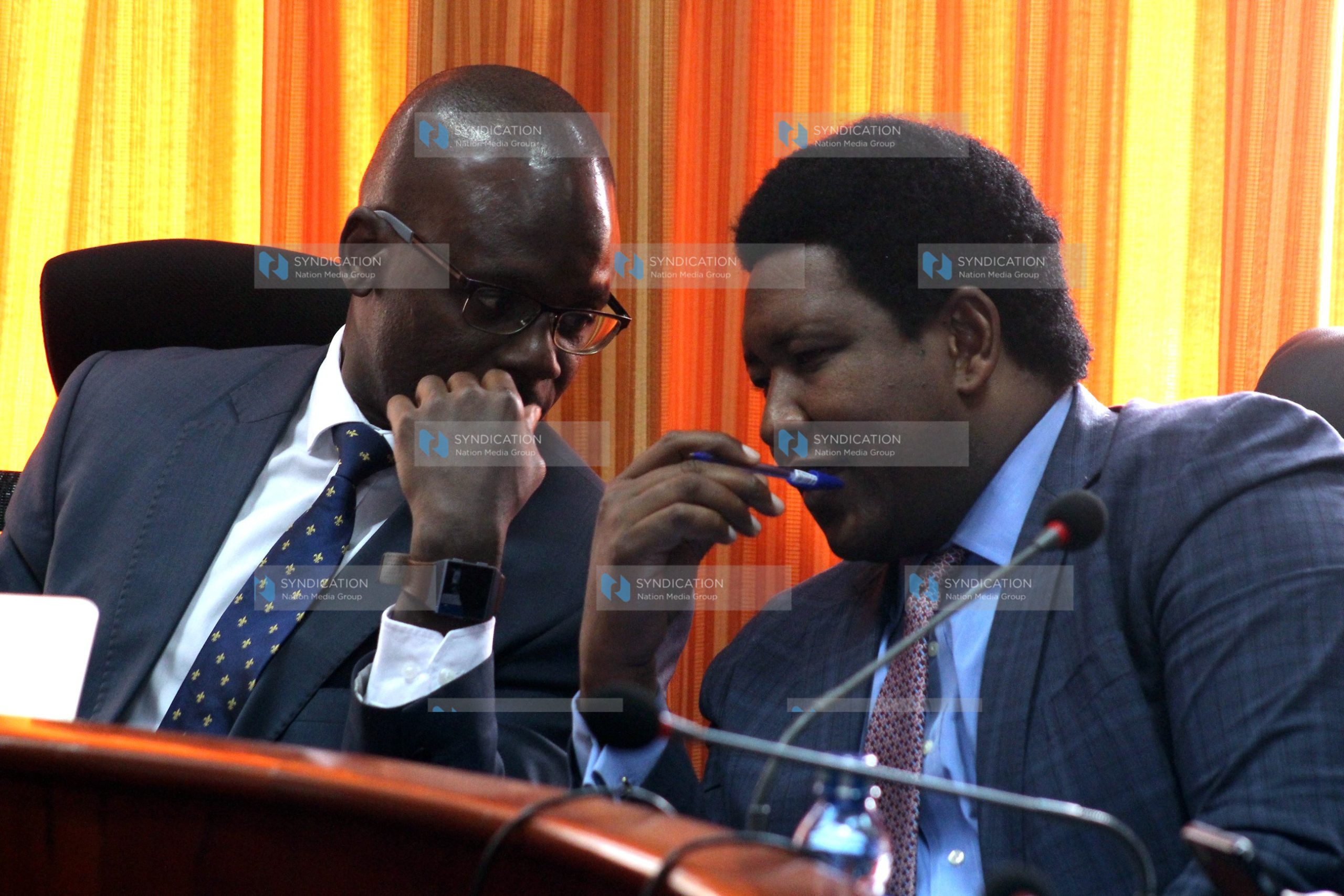 Moses Kajwang’ (left) and Narok Senator Ledama Ole Kina shares a word