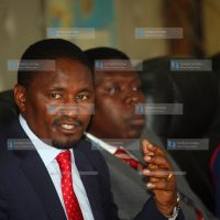 Devolution and Planning Cabinet Secretary Mwangi Kiunjuri (left)