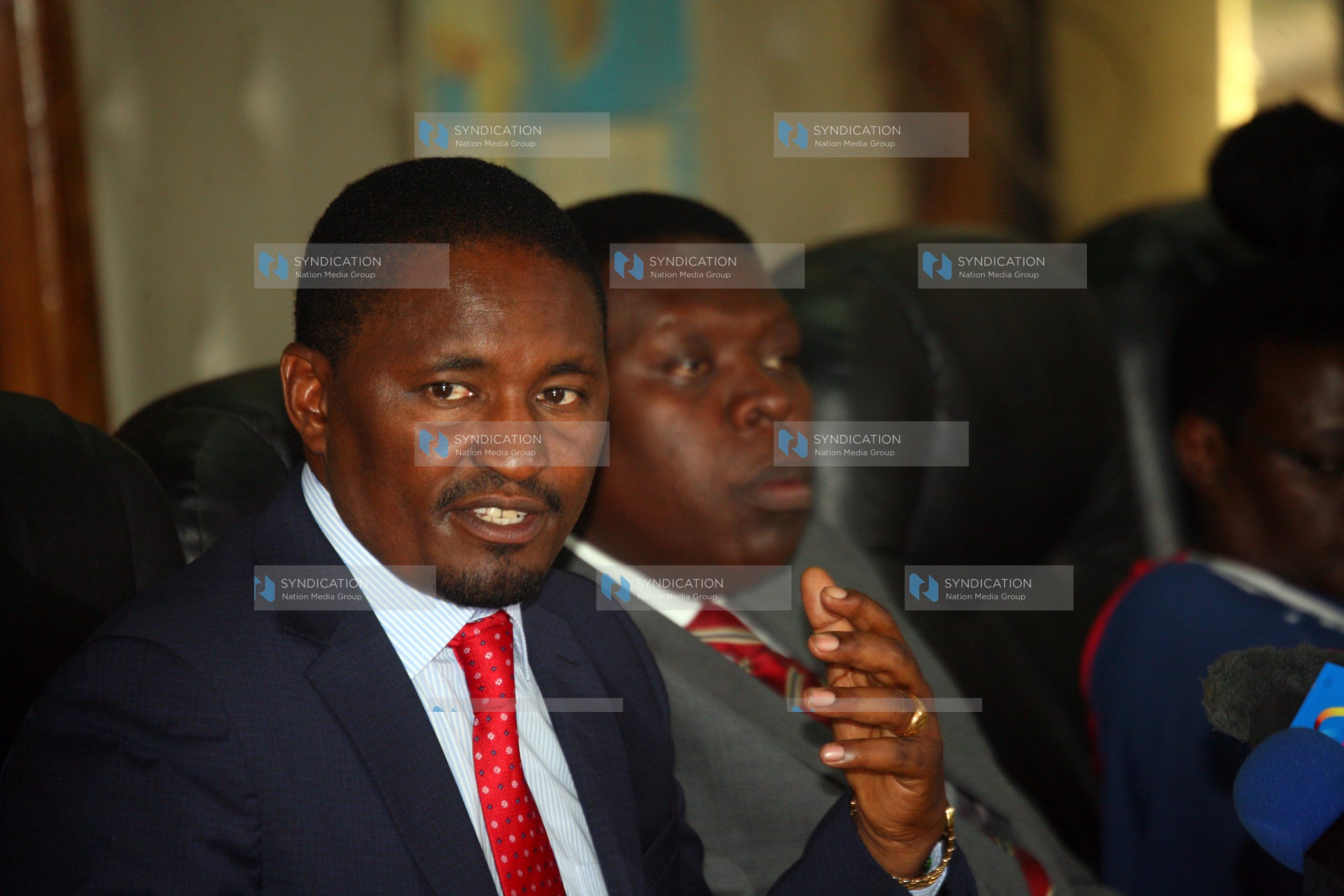 Devolution and Planning Cabinet Secretary Mwangi Kiunjuri (left)