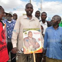 Uasin Gishu County gubernatorial aspirant Solomon Kiptarbei Martim (with bicycle)