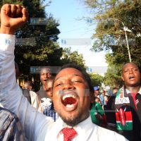 A Man participates in a peaceful demonstration along Nairobi Streets