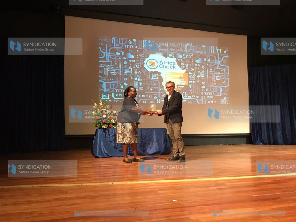 Dorothy Otieno, Data Editor, receives the Africa Fact-Checking Award for 2017 on behalf of the Nation Newsplex team