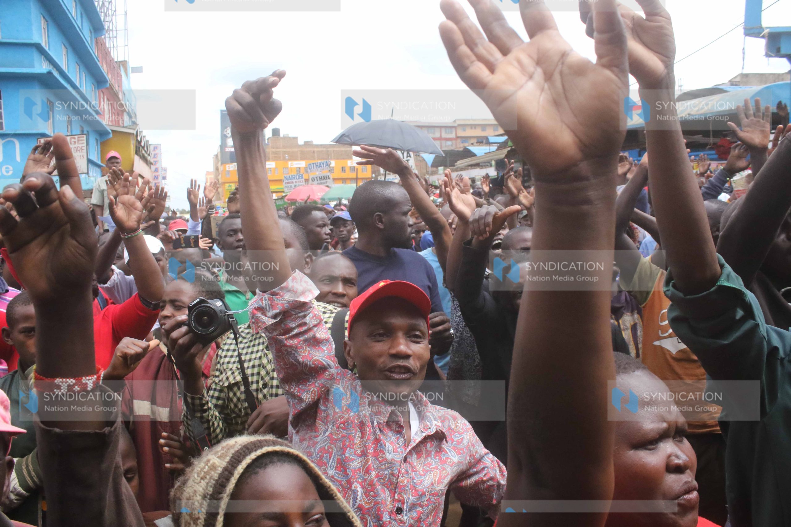 Residents of Nyeri follow proceedings during a campaign