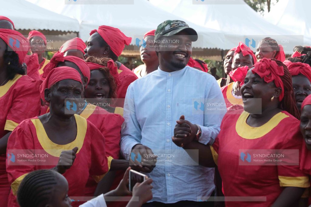 Agriculture Cabinet Secretary Mwangi Kiunjuri joins in a dance during a public participation forum
