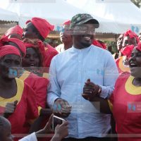 Agriculture Cabinet Secretary Mwangi Kiunjuri joins in a dance during a public participation forum