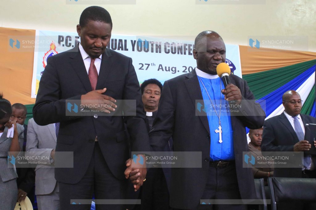 PCEA Church Moderator Julius Mwamba prays for Devolution CS Mwangi Kiunjuri