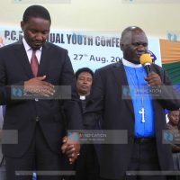 PCEA Church Moderator Julius Mwamba prays for Devolution CS Mwangi Kiunjuri