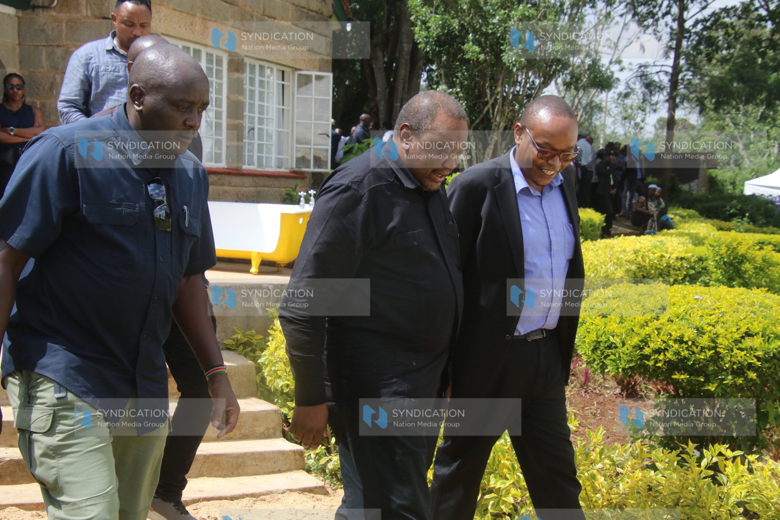 Former President Uhuru Kenyatta arrives at the burial of Kanja Waruru