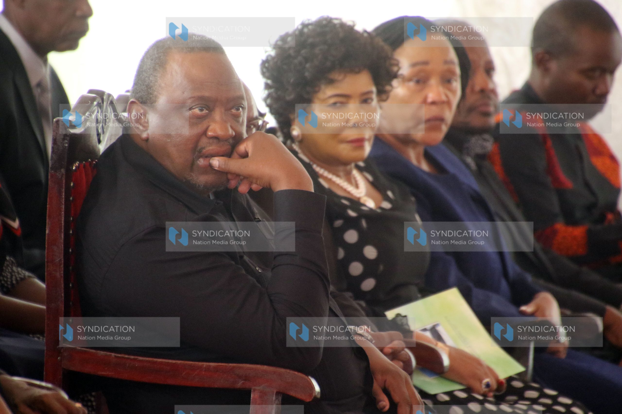 Former President Uhuru Kenyatta speaks among mourners