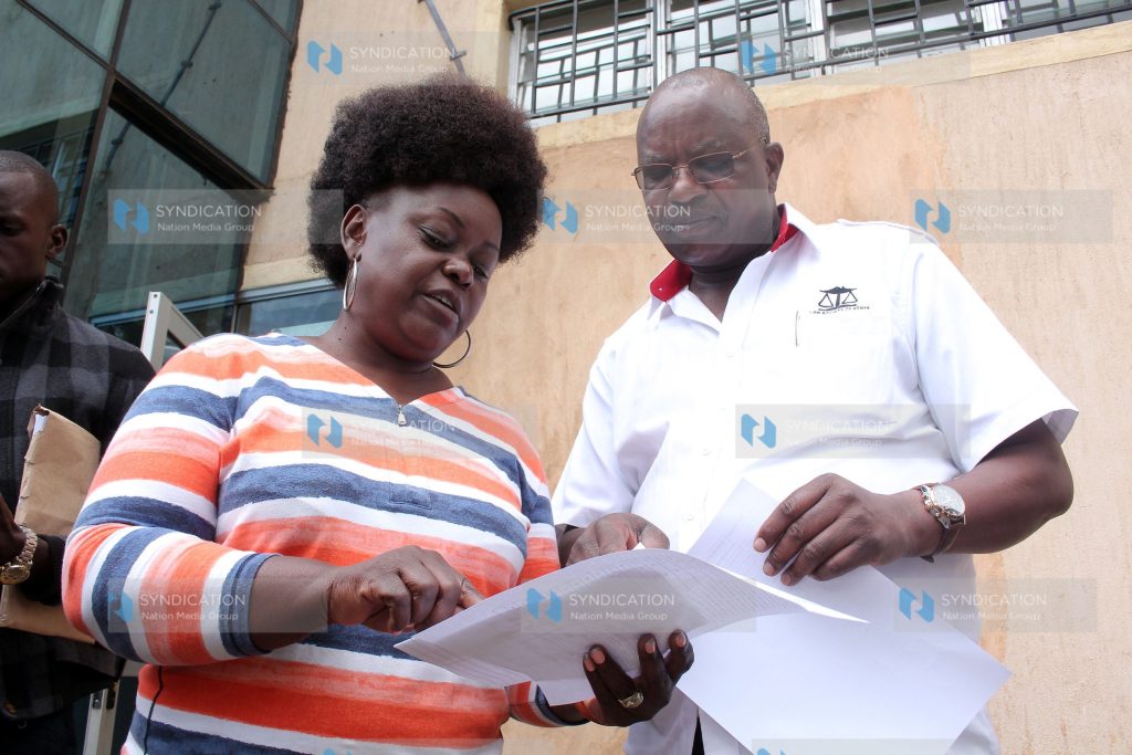 Mbita MP Millie Odhiambo with his lawyer Harun Ndubi at a Nairobi hotel