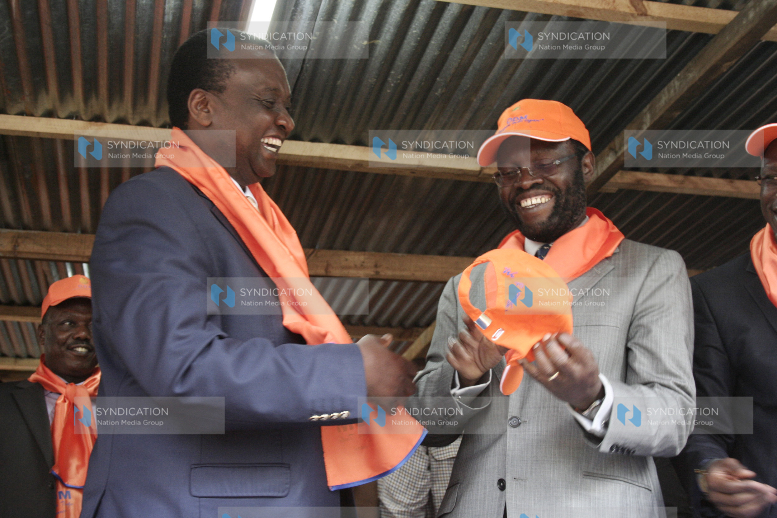 Gitobu Imanyara (left) being welcomed into ODM party by secretary general Prof Anyang Nyong’o