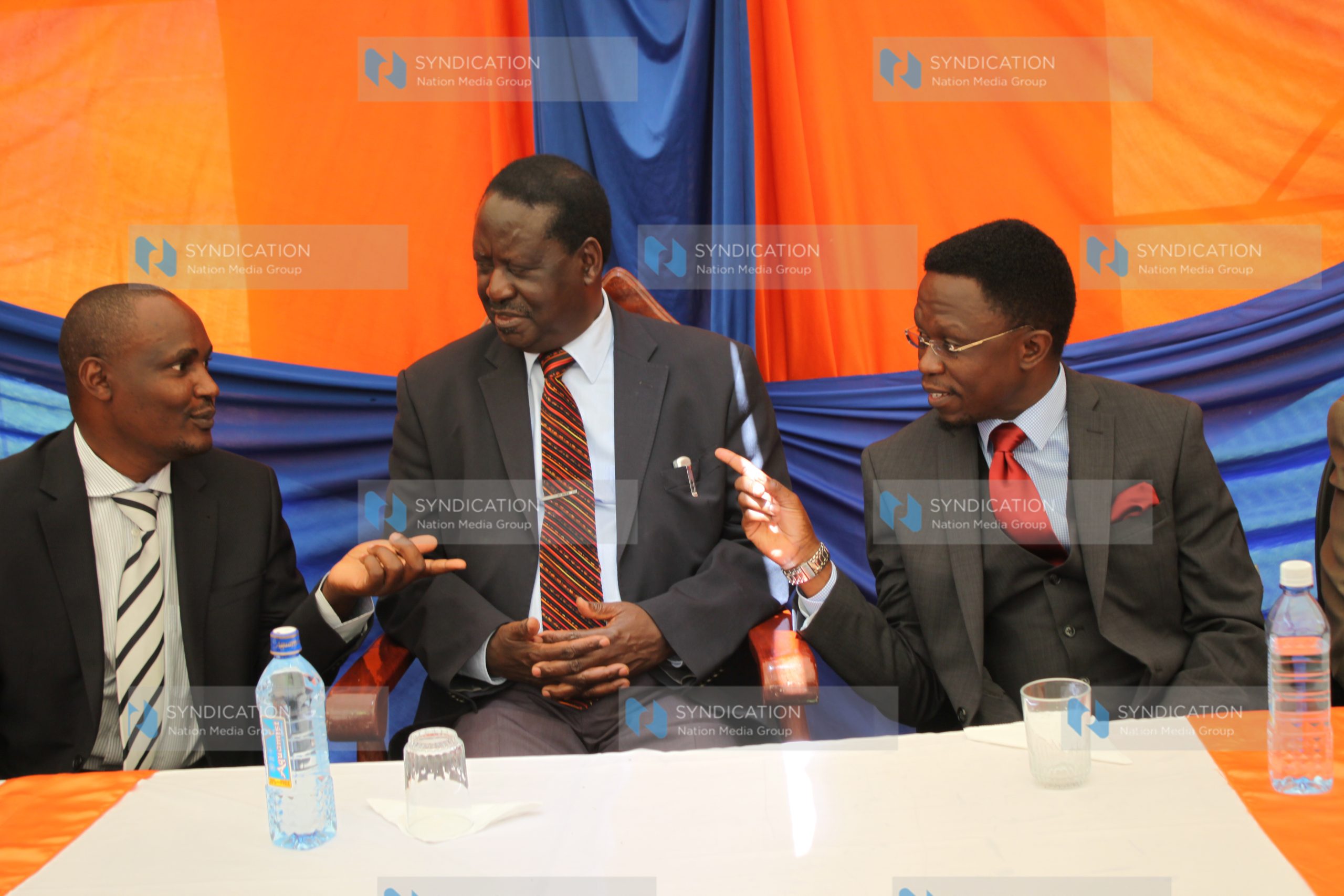 Raila Odinga (centre) with Party Secretary General Ababu Namwamba