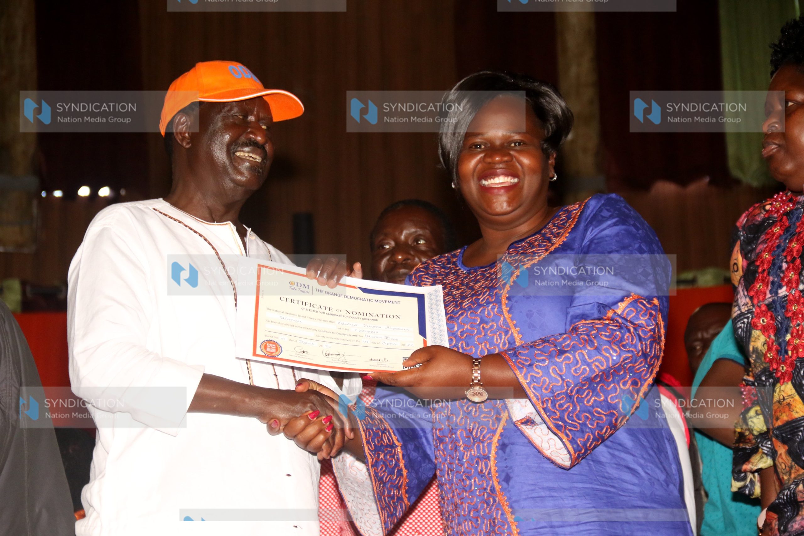 Homa Bay Gubernatorial aspirant Gladys Wanga receiving her nomination certificate from ODM leader Raila Odinga
