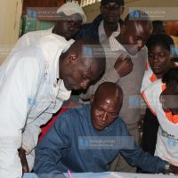 Senator of Kakamega Boni Khalwale collecting OKOA Kenya signatures from health workers