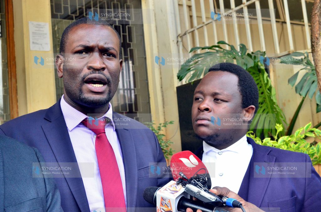 Edwin Sifuna (left) lawyer to the family of the late Kibra MP Ken Okoth addressing media