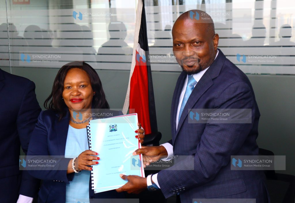 Moses Kuria (right) hands over the Ministry of Investments, Trade and Industry