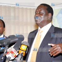 Raila Odinga, accompanied by Moses Wetang’ula and Martha Karua, address the press