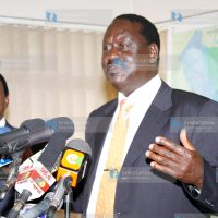 Raila Odinga, accompanied by Moses Wetangula and Martha Karua, address the press