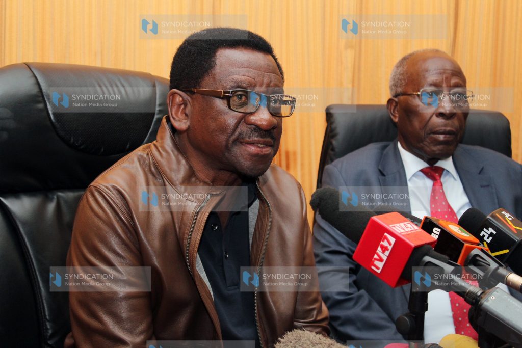 Senate Minority Leader James Orengo (left) addresses the media