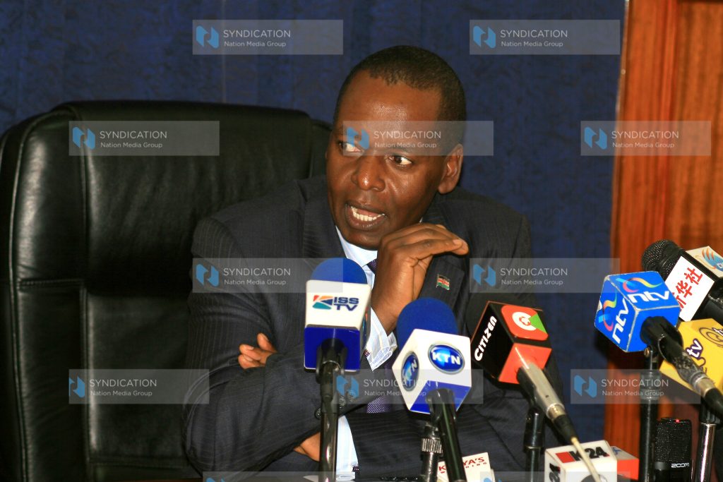 Transport minister Amos Kimunya (left) made a brief address to the media