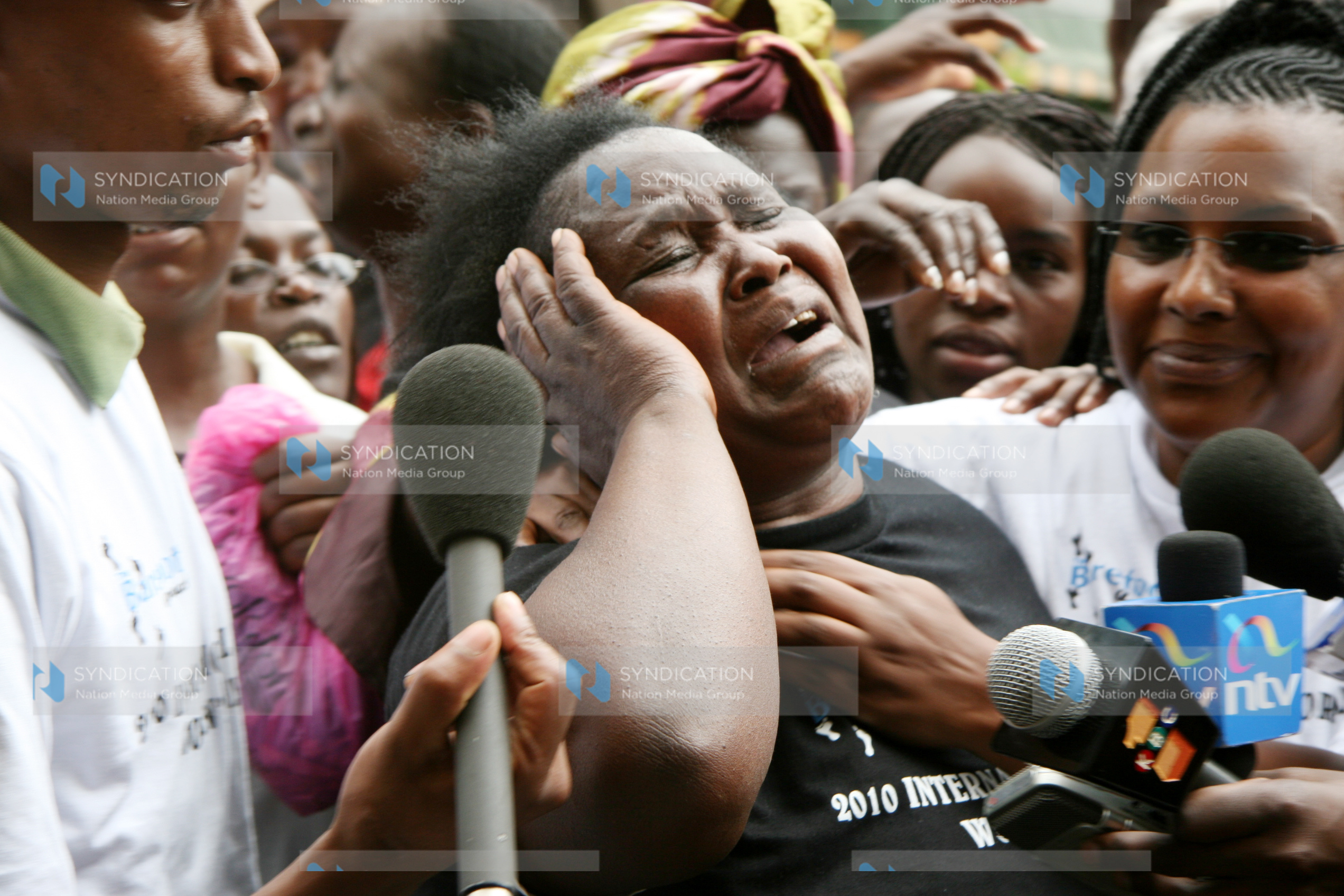 A woman protester cries as they demonstrate outside Nation Centre