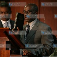 Senator David Musila (right) is sworn in as a member of the Parliamentary Service Commission